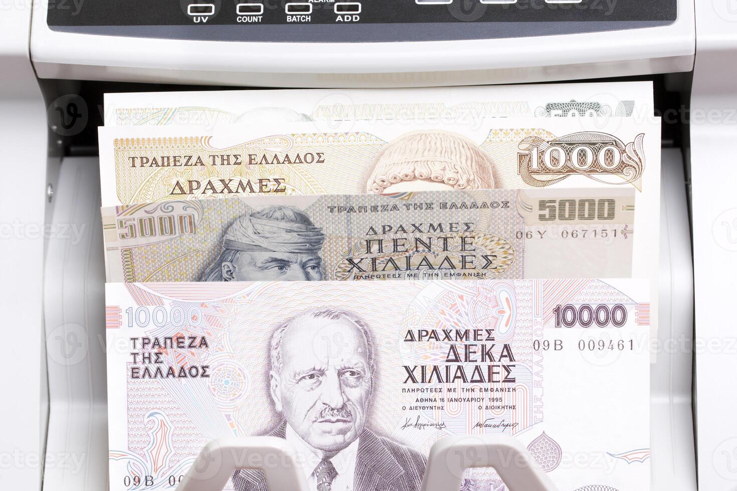 Greek drachma in the counting machine photo