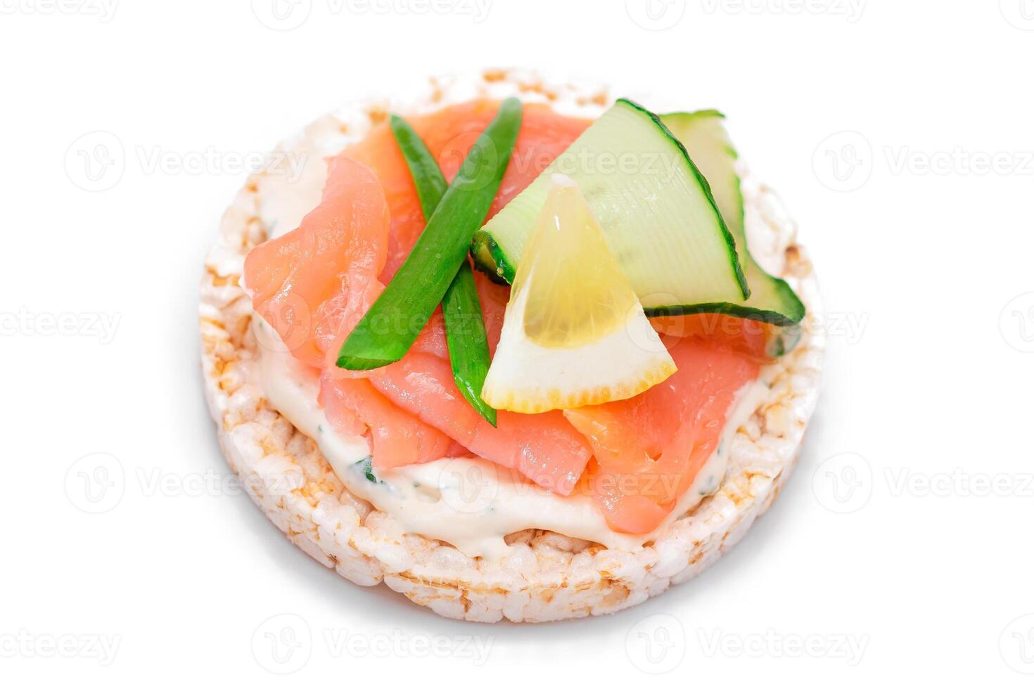 Rice Cake Sandwich with Fresh Salmon, Lemon and Greens - Isolated on White Background. Diet Food. Quick and Healthy Sandwiches. Crispbread with Fresh Fillings. Healthy Dietary Snack photo