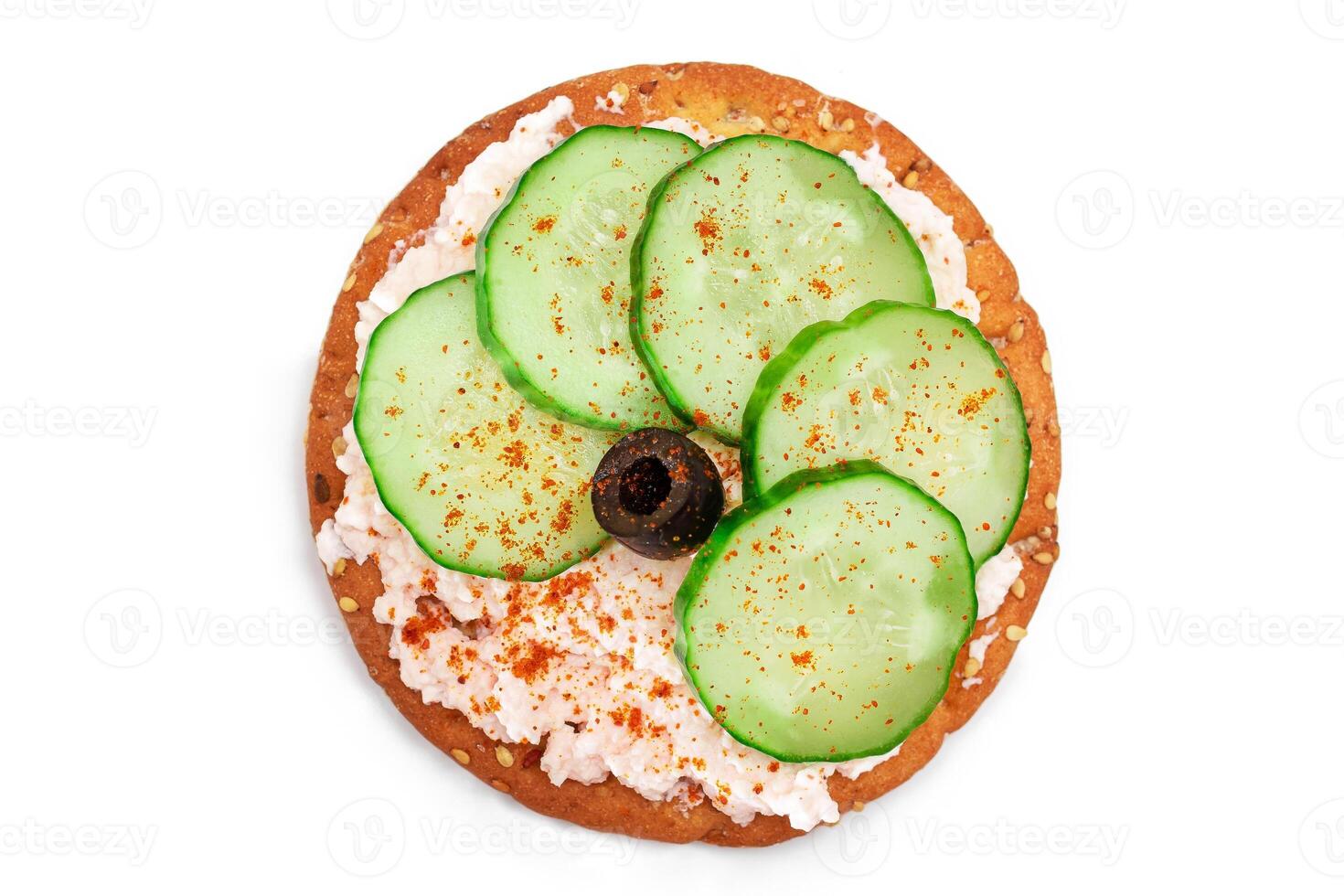 Crispy Cracker Sandwich with Fresh Cucumber, Fish Cream and Olives - Isolated on White. Easy Breakfast. Quick and Healthy Sandwiches. Crispbread with Tasty Filling. Healthy Dietary Snack - Isolation photo