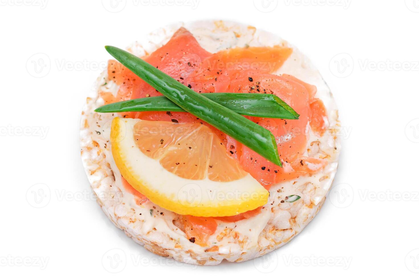 Rice Cake Sandwich with Fresh Salmon, Lemon and Green Onions - Isolated on White Background. Diet Food. Quick and Healthy Sandwiches. Crispbread with Fresh Fillings. Healthy Dietary Snack photo