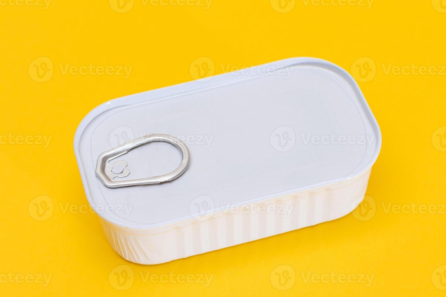Tin Can on Yellow Background. Canned Food. Aluminum Can for Safe and Long Term Storage of Food. Steel Sealed Food Storage Container photo