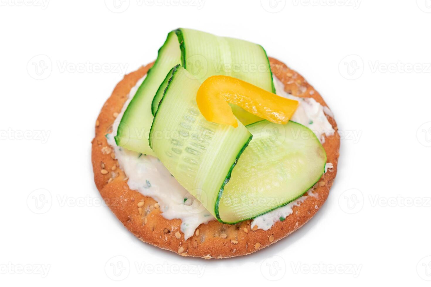 Crispy Cracker Sandwich with Fresh Cucumber, Yellow Paprika and Cottage Cheese - Isolated on White. Easy Breakfast. Quick and Healthy Sandwiches. Crispbread with Tasty Filling. Healthy Dietary Snack photo