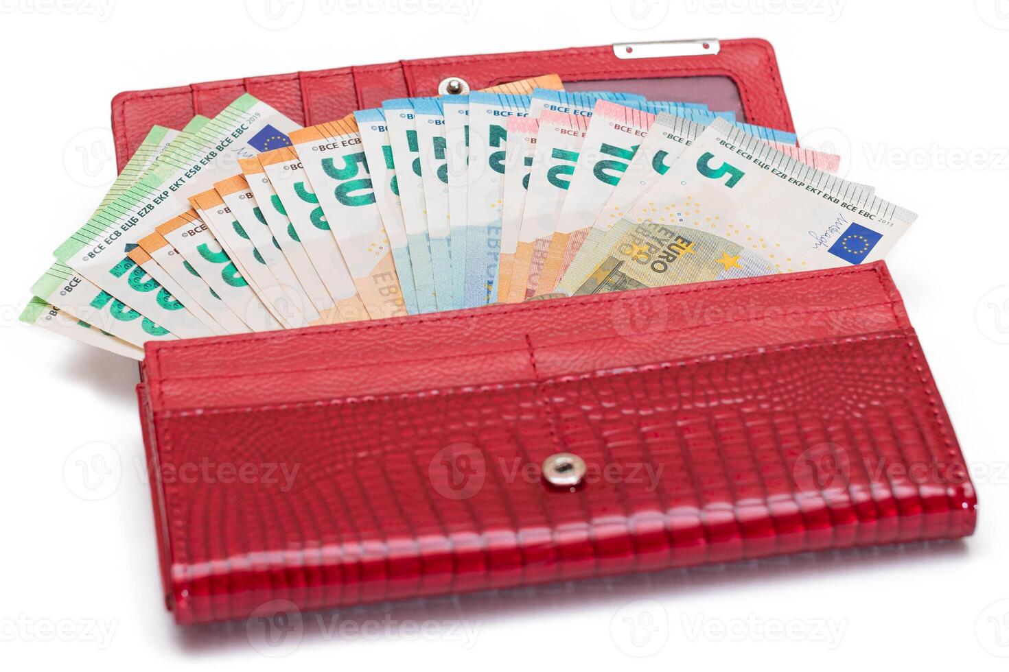 Red Leather Women Purse with Different Euro Banknotes - Isolated on White Background. A Wallet Full of European Union Paper Money Symbolizing Wealth, Success and Social Status - Isolation photo