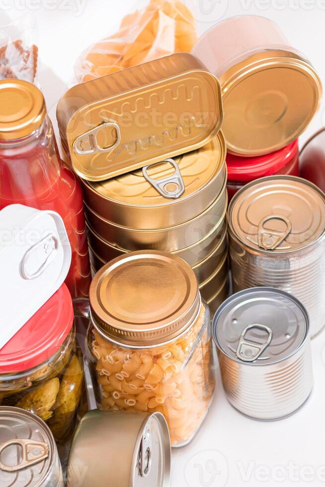 Food Reserves. Canned Food, Spaghetti, Pate, Tuna, Tomato Juice, Pasta, Fish and Grocery. Emergency Food Storage in Case of Crisis. Strategic Food Supplies photo
