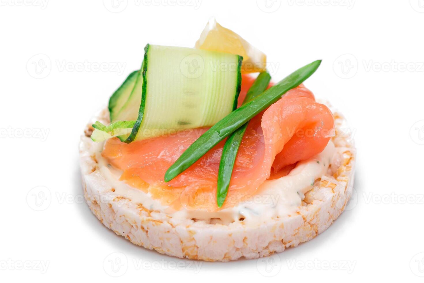 Rice Cake Sandwich with Fresh Salmon, Lemon and Greens - Isolated on White Background. Diet Food. Quick and Healthy Sandwiches. Crispbread with Fresh Fillings. Healthy Dietary Snack photo