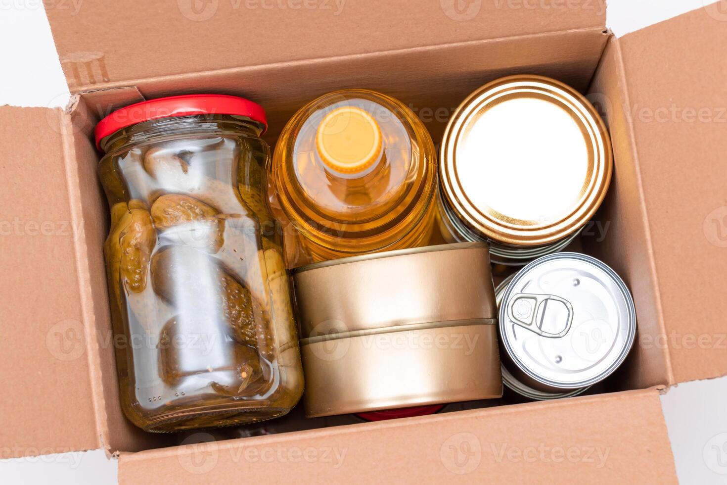 Food Reserves or Donation Box. Carton Box with Canned Food, Cereals and Grocery. Emergency Food Storage in Case of Crisis. Free Social Help, Blessings and Care. Strategic Food Supplies photo