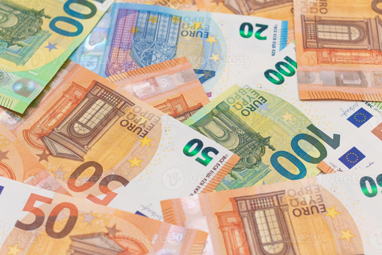 Different Euro Banknotes Money Background. Euro Money Currency. Colored Paper Money. A Lot of Fifty Euro Bills. Business, Finances, Cash and Money Saving Concept photo