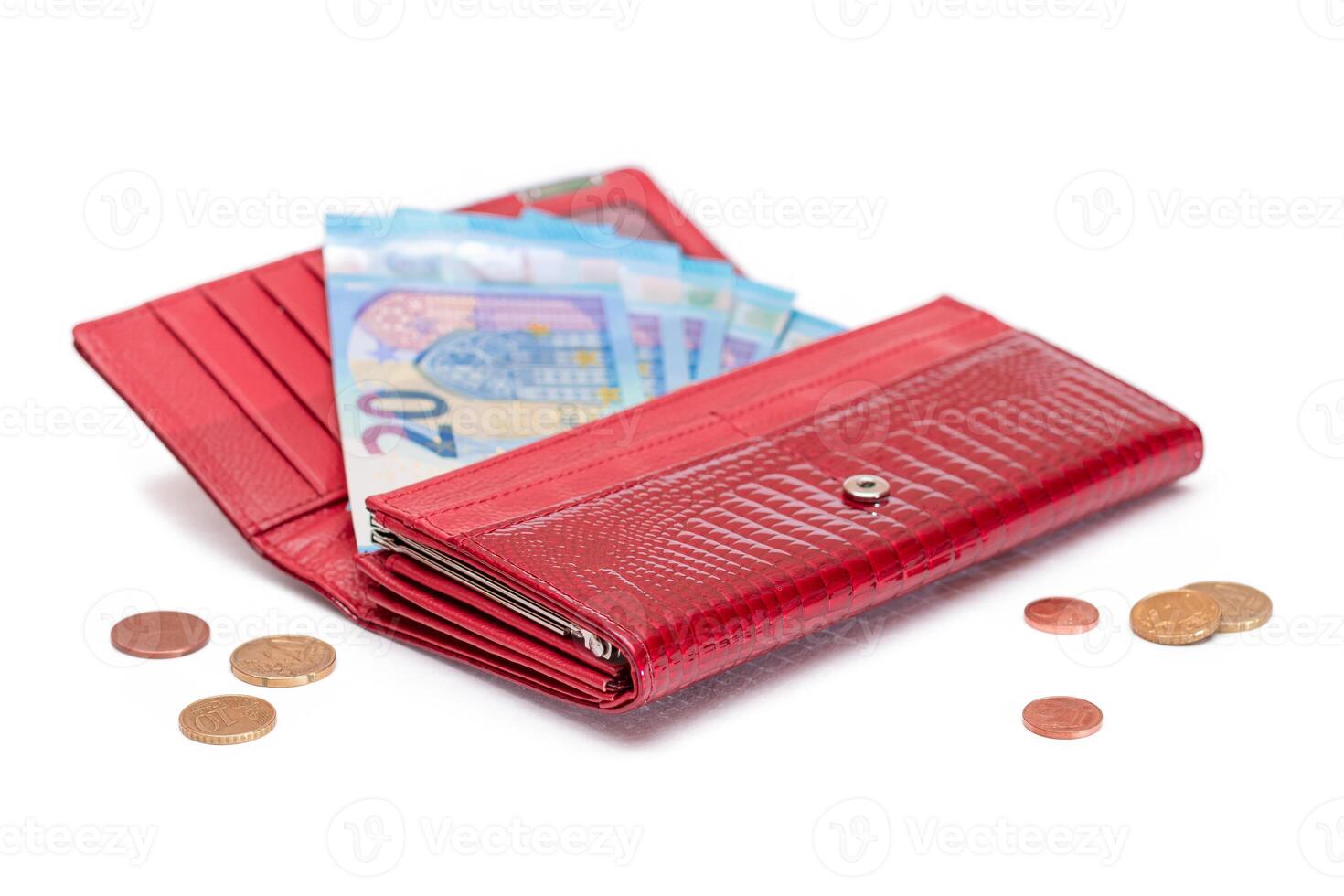 Opened Red Women Purse with 20 Euro Banknotes Inside and Scattered Euro Cent Coins - Isolated on White Background. A Wallet Full of Money Symbolizing Wealth, Success, Shopping and Social Status - Isolation photo