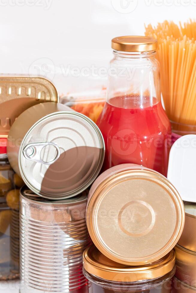 Food Reserves. Canned Food, Spaghetti, Tomato Juice, Pasta and Grocery. Emergency Food Storage in Case of Crisis. Strategic Food Supplies photo