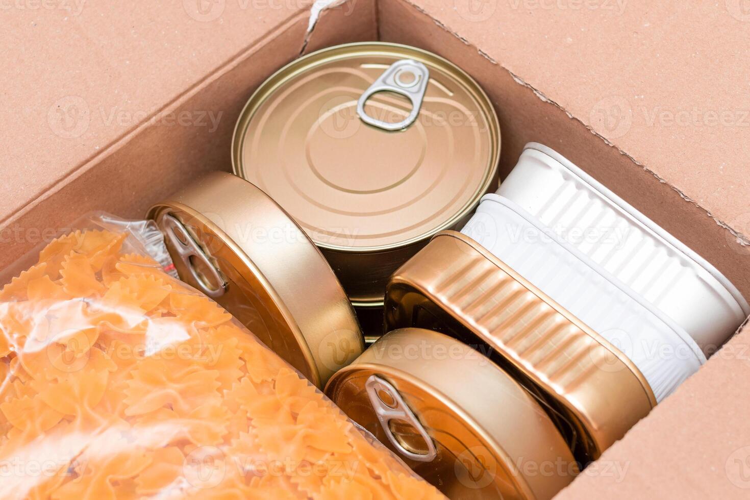 Food Reserves or Donation Box. Carton Box with Canned Food, Cereals and Grocery. Emergency Food Storage in Case of Crisis. Free Social Help, Blessings and Care. Strategic Food Supplies photo