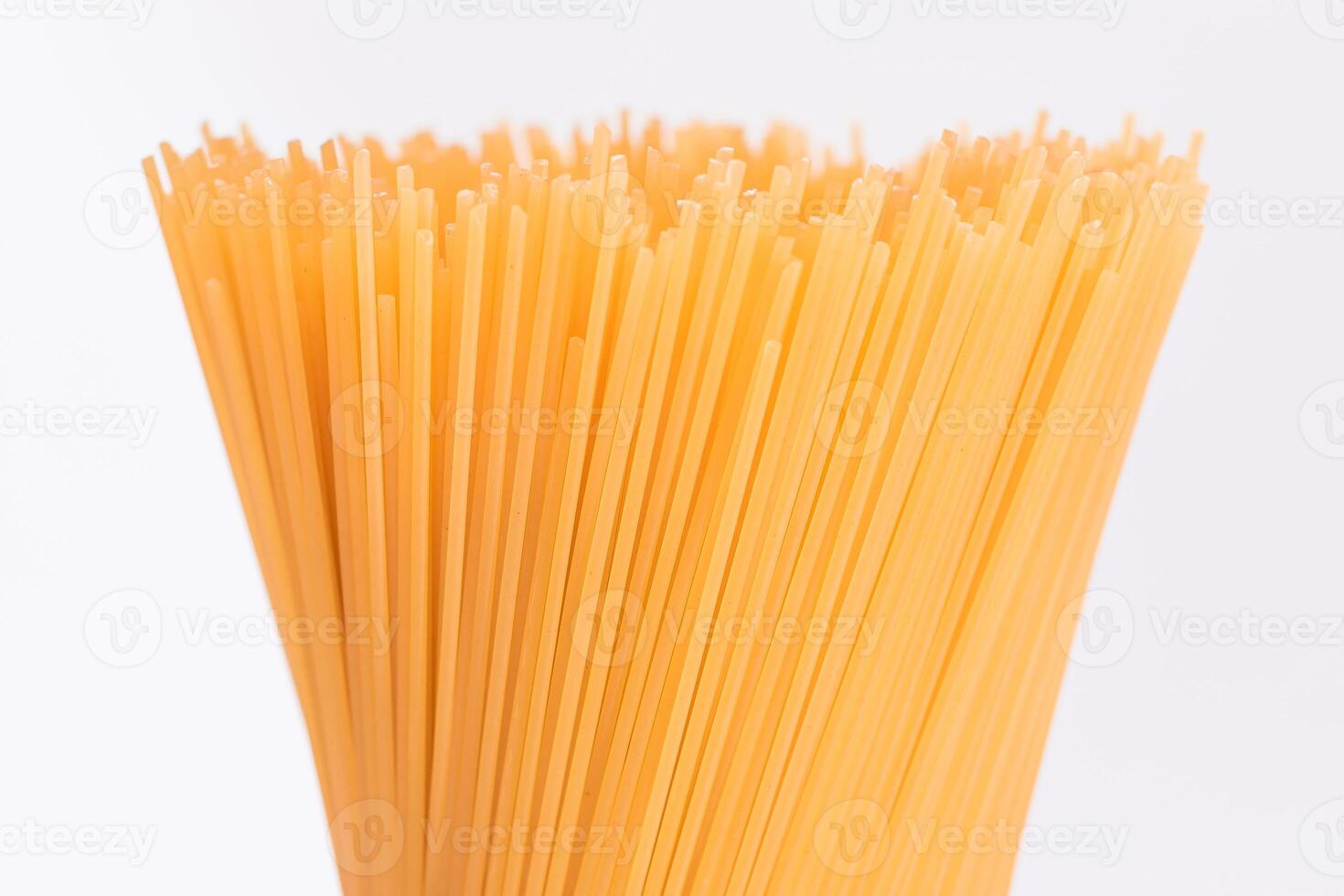 Dry Uncooked Spaghetti Isolated on White Background - Close-Up. Raw Pasta - Isolation photo