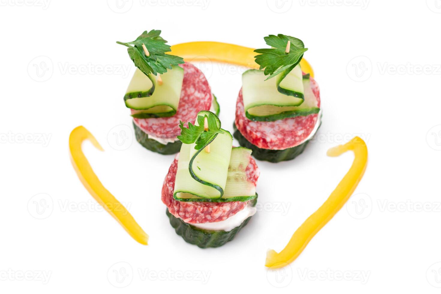 Canapes without Bread with Salami, Cucumber, Greens and Cream Cheese - Isolated on White Background. Easy Breakfast. Diet Food. Quick and Healthy Sandwiches. Healthy Snacks with Tasty Fillings photo