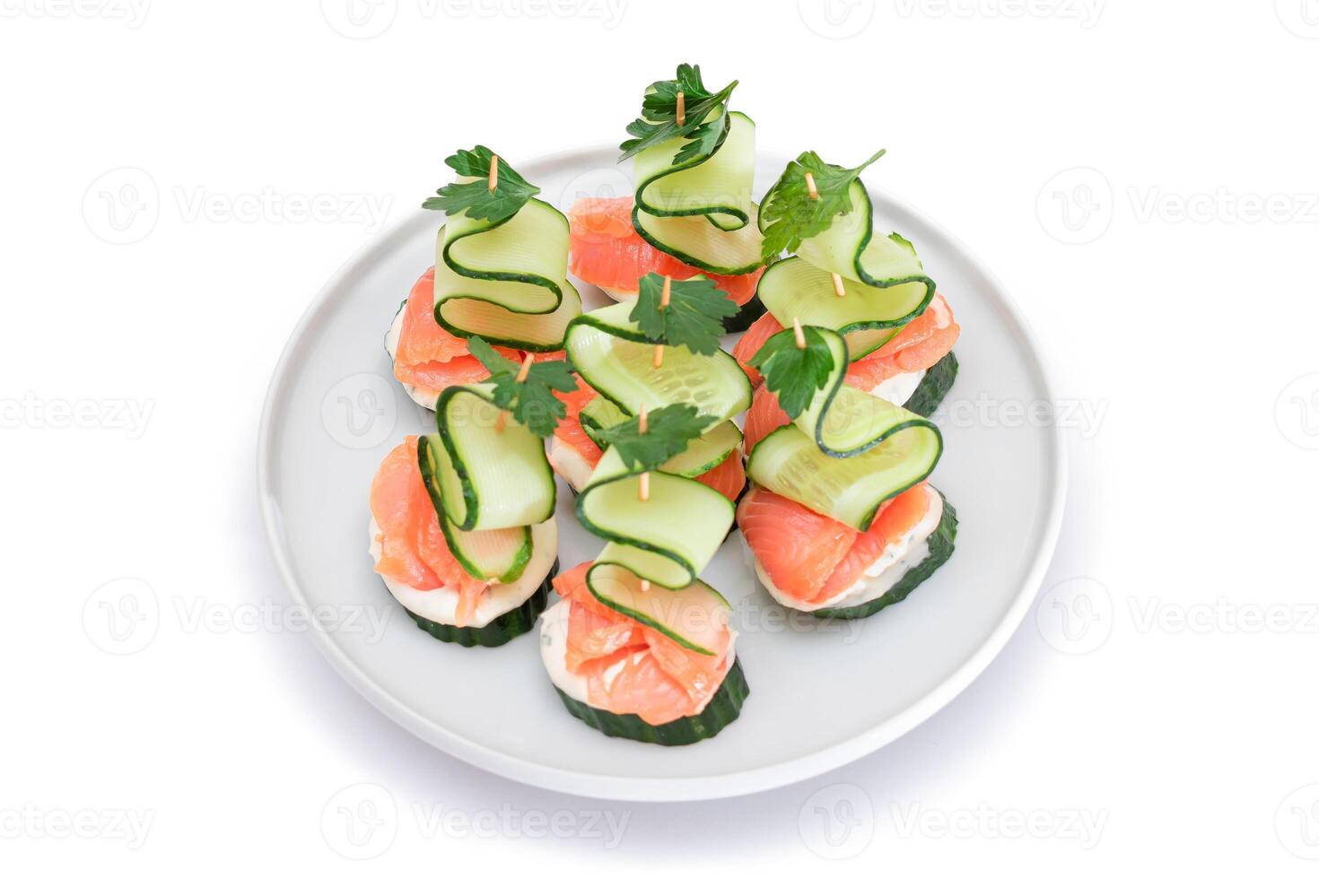 Canapes without Bread with Fresh Salmon, Cucumber and Cream Cheese - Isolated on White Background. Easy Breakfast. Diet Food. Quick and Healthy Sandwiches. Healthy Snacks with Tasty Fillings photo