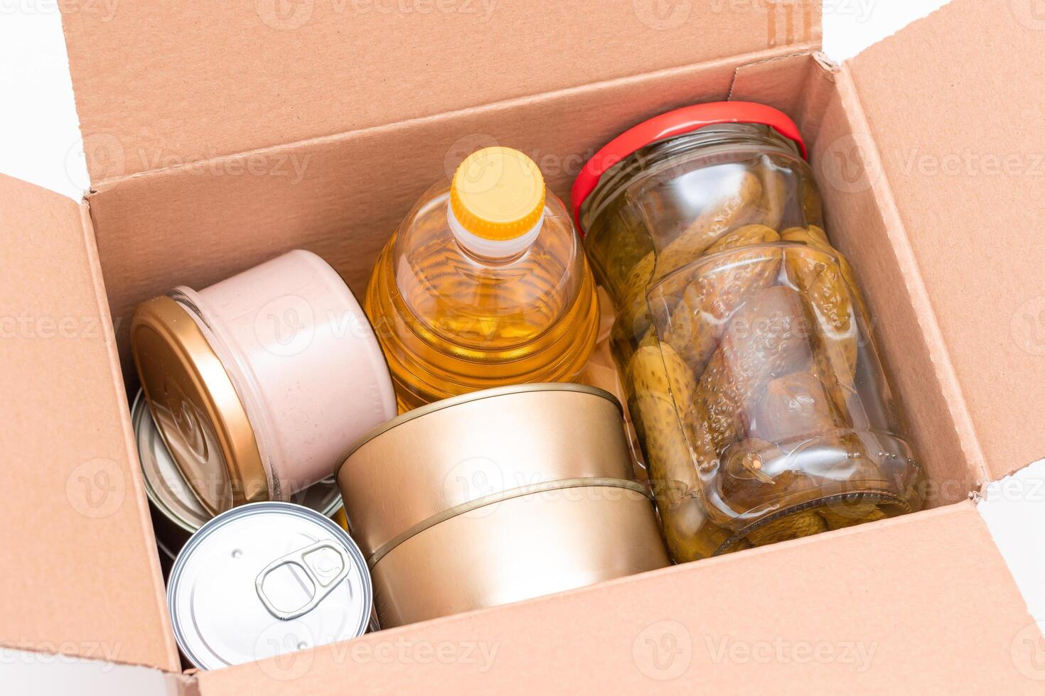 Food Reserves or Donation Box. Carton Box with Canned Food, Cereals and Grocery. Emergency Food Storage in Case of Crisis. Free Social Help, Blessings and Care. Strategic Food Supplies photo