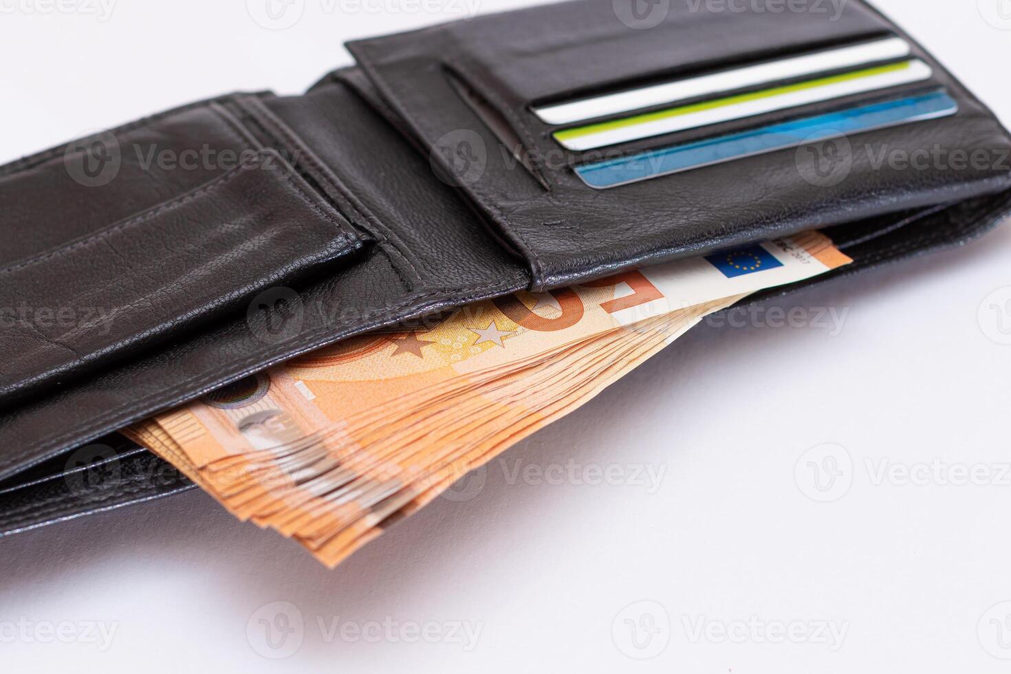 Opened Black Leather Men Wallet with Fifty Euro Banknotes and Bank Cards Inside on White Background. A Purse Full of Money and Credit Cards Symbolizing Wealth, Success and Social Status photo