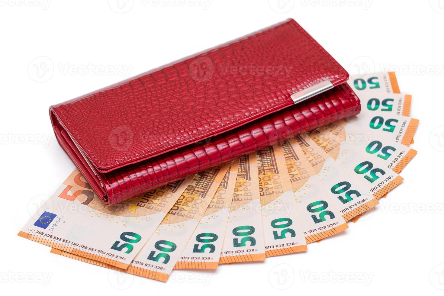 Red Leather Women Purse with Fifty Euro Banknotes - Isolated on White Background. A Wallet Full of 50 Euro Paper Money Symbolizing Wealth, Success and Social Status - Isolation photo