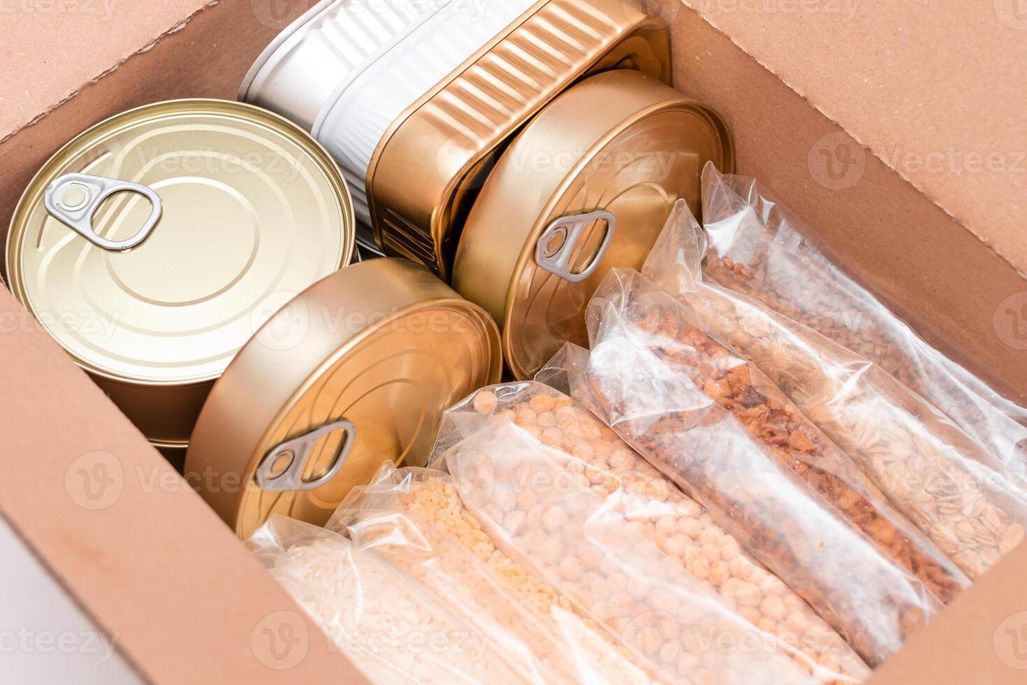 Food Reserves or Donation Box. Carton Box with Canned Food, Cereals and Grocery. Emergency Food Storage in Case of Crisis. Free Social Help, Blessings and Care. Strategic Food Supplies photo