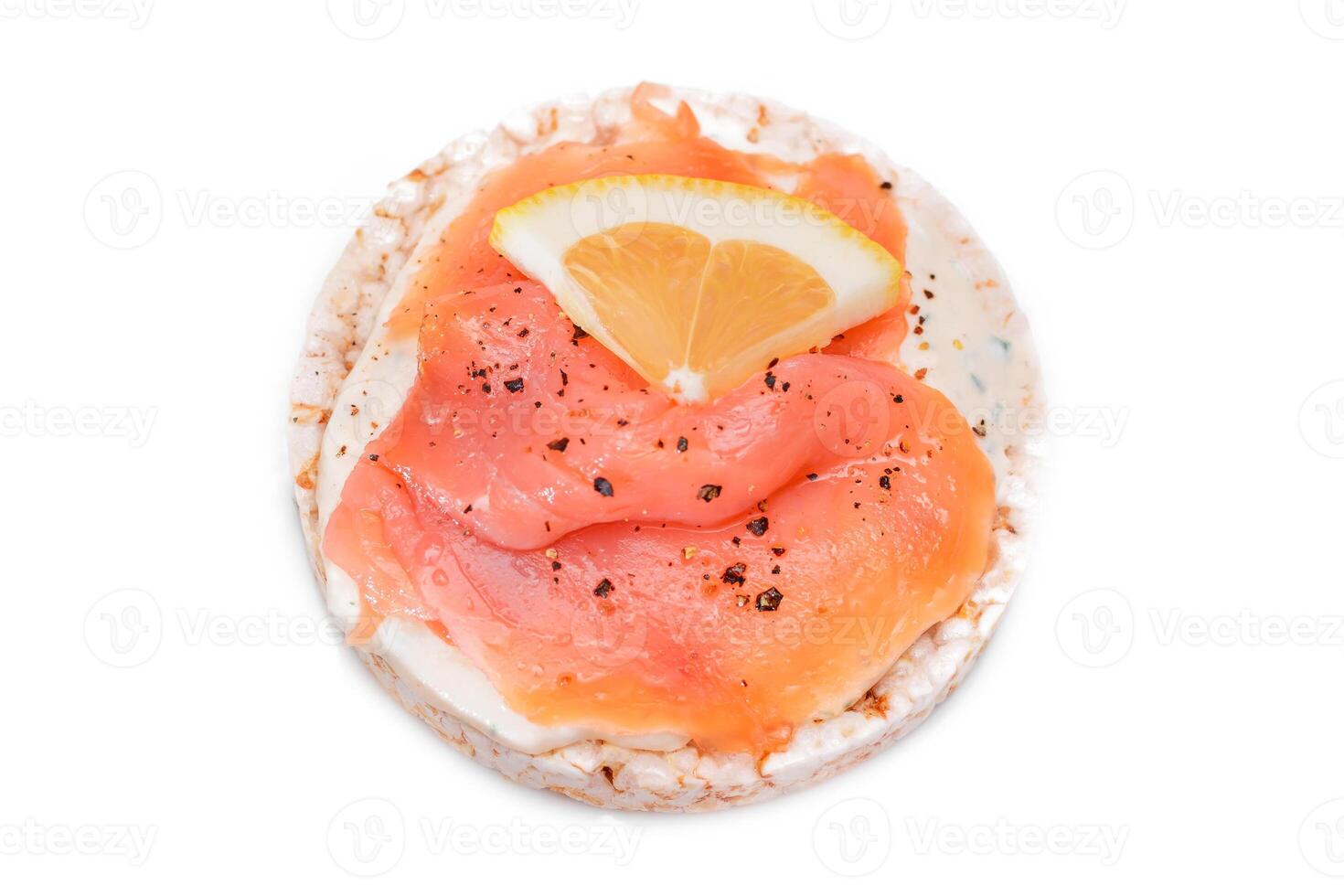 Rice Cake Sandwich with Fresh Salmon and Lemon - Isolated on White Background. Diet Food. Quick and Healthy Sandwiches. Crispbread with Fresh Fillings. Healthy Dietary Snack photo
