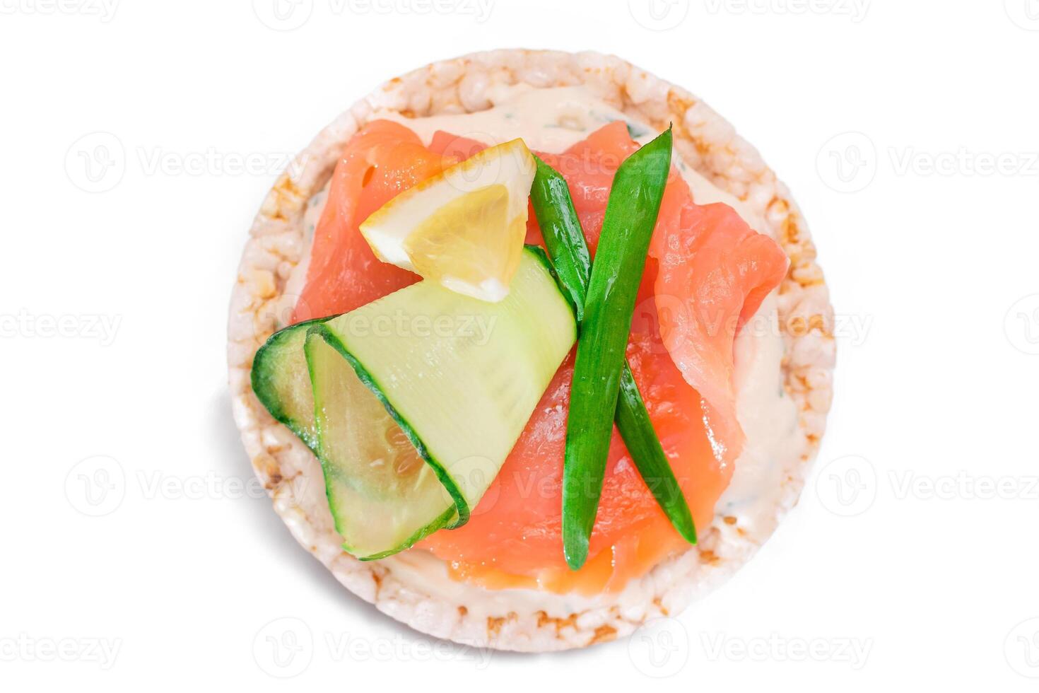 Rice Cake Sandwich with Fresh Salmon, Lemon and Greens - Isolated on White Background. Diet Food. Quick and Healthy Sandwiches. Crispbread with Fresh Fillings. Healthy Dietary Snack photo