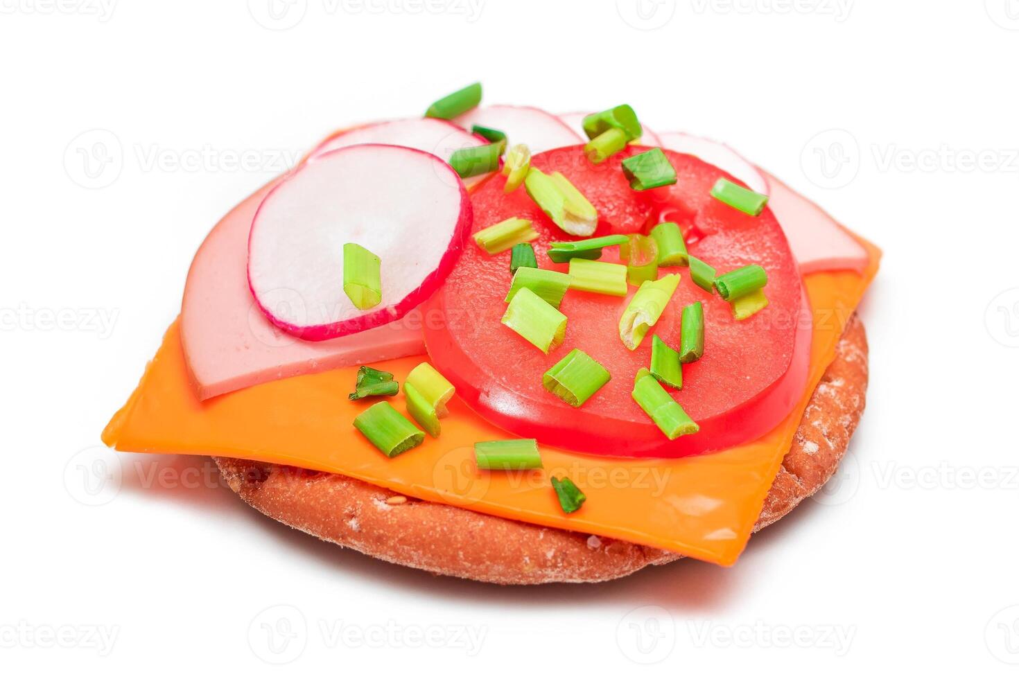 Crispy Cracker Sandwich with Tomato, Sausage, Cheese, Green Onions and Radish - Isolated on White. Easy Breakfast. Diet Food. Quick and Healthy Sandwiches. Crispbread with Tasty Filling - Isolation photo