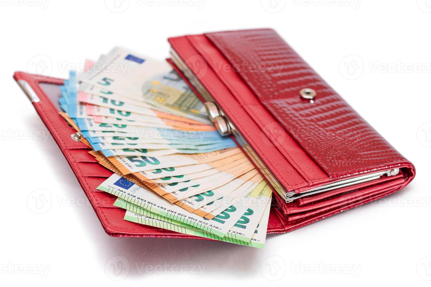 Red Leather Women Purse with Different Euro Banknotes - Isolated on White Background. A Wallet Full of European Union Paper Money Symbolizing Wealth, Success and Social Status - Isolation photo