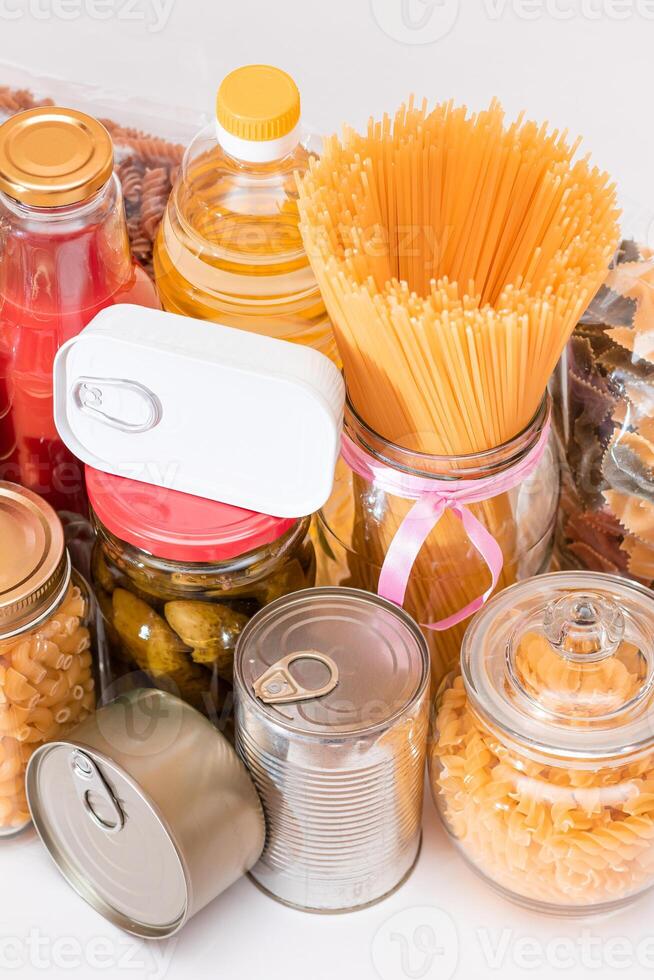 Food Reserves. Canned Food, Spaghetti, Pate, Tuna, Tomato Juice, Pasta, Fish and Grocery. Emergency Food Storage in Case of Crisis. Strategic Food Supplies photo