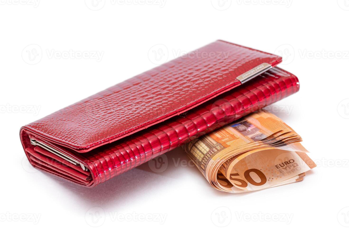 Red Leather Women Purse with Fifty Euro Banknotes - Isolated on White Background. A Wallet Full of 50 Euro Paper Money Symbolizing Wealth, Success and Social Status - Isolation photo