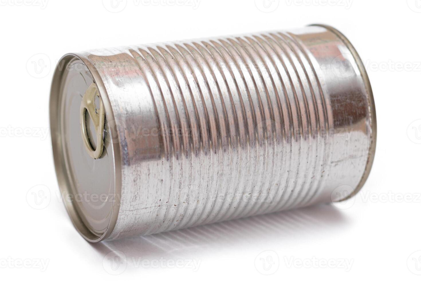Round Unopened Tin Can Isolated on White Background. Canned Food. Aluminum Can for Safe and Long Term Storage of Food. Steel Sealed Food Storage Container - Isolation photo