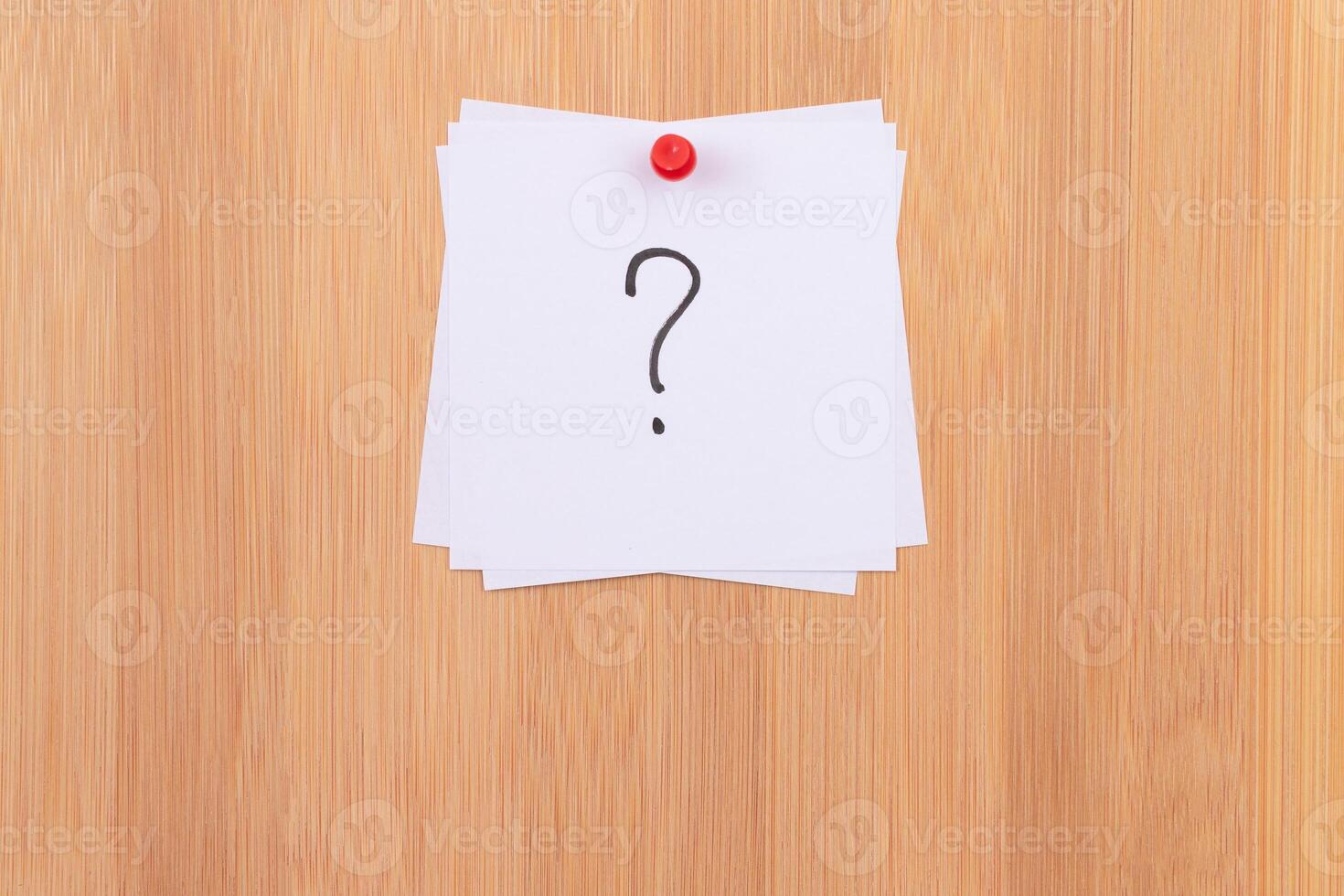 White Sticky Notes with Question Mark Pinned to the Wooden Message Board. To Do List Reminder in the Office. Memo Note at Work photo