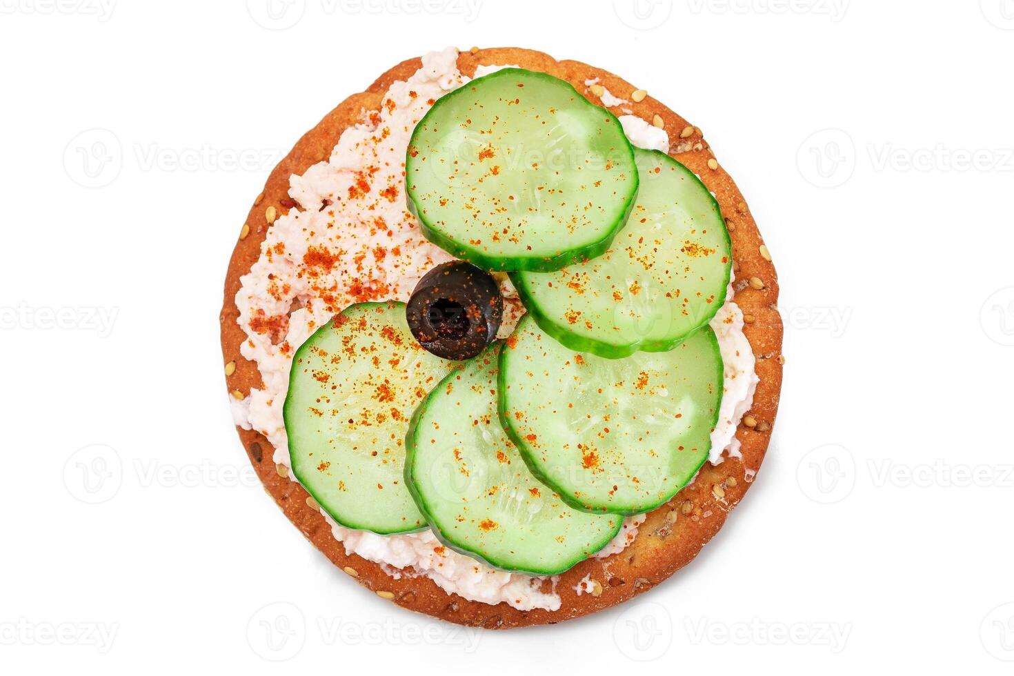 Crispy Cracker Sandwich with Fresh Cucumber, Fish Cream and Olives - Isolated on White. Easy Breakfast. Quick and Healthy Sandwiches. Crispbread with Tasty Filling. Healthy Dietary Snack - Isolation photo
