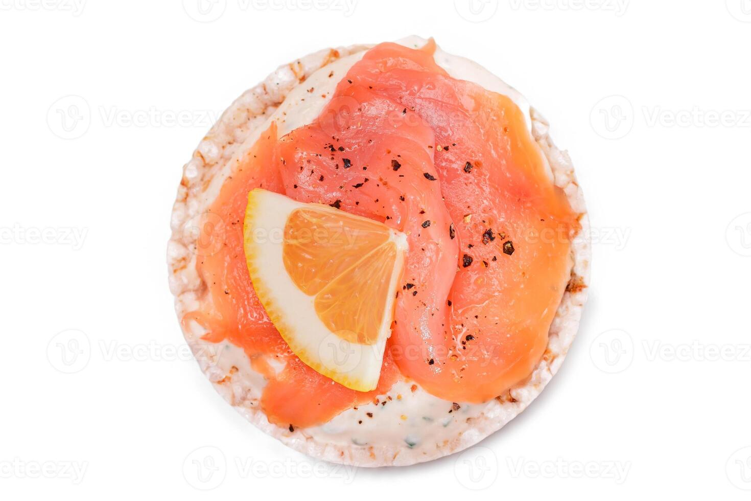 Rice Cake Sandwich with Fresh Salmon and Lemon - Isolated on White Background. Diet Food. Quick and Healthy Sandwiches. Crispbread with Fresh Fillings. Healthy Dietary Snack photo