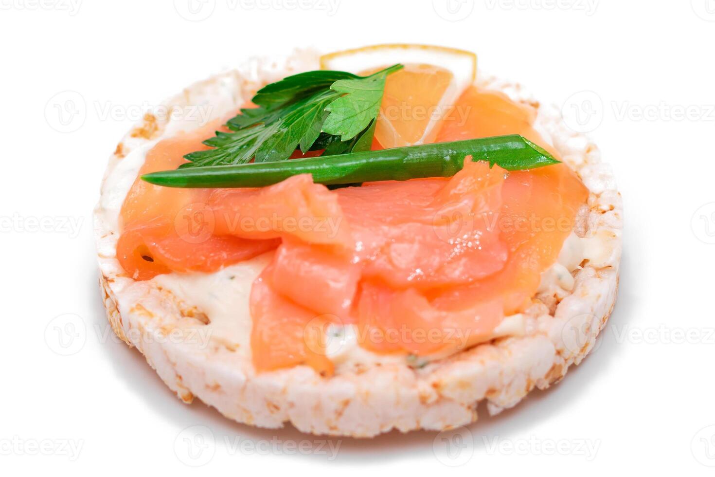 Rice Cake Sandwich with Fresh Salmon, Lemon and Greens - Isolated on White Background. Diet Food. Quick and Healthy Sandwiches. Crispbread with Fresh Fillings. Healthy Dietary Snack photo