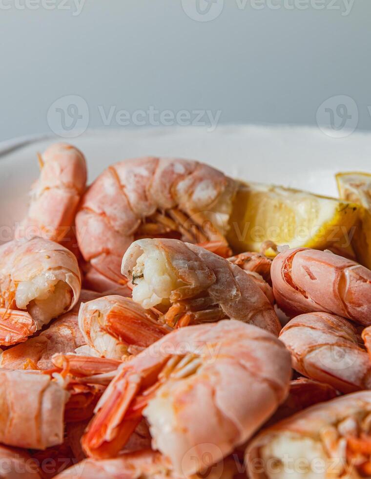 Tiger king prawns cooked and seasoned with lemon, close up photo