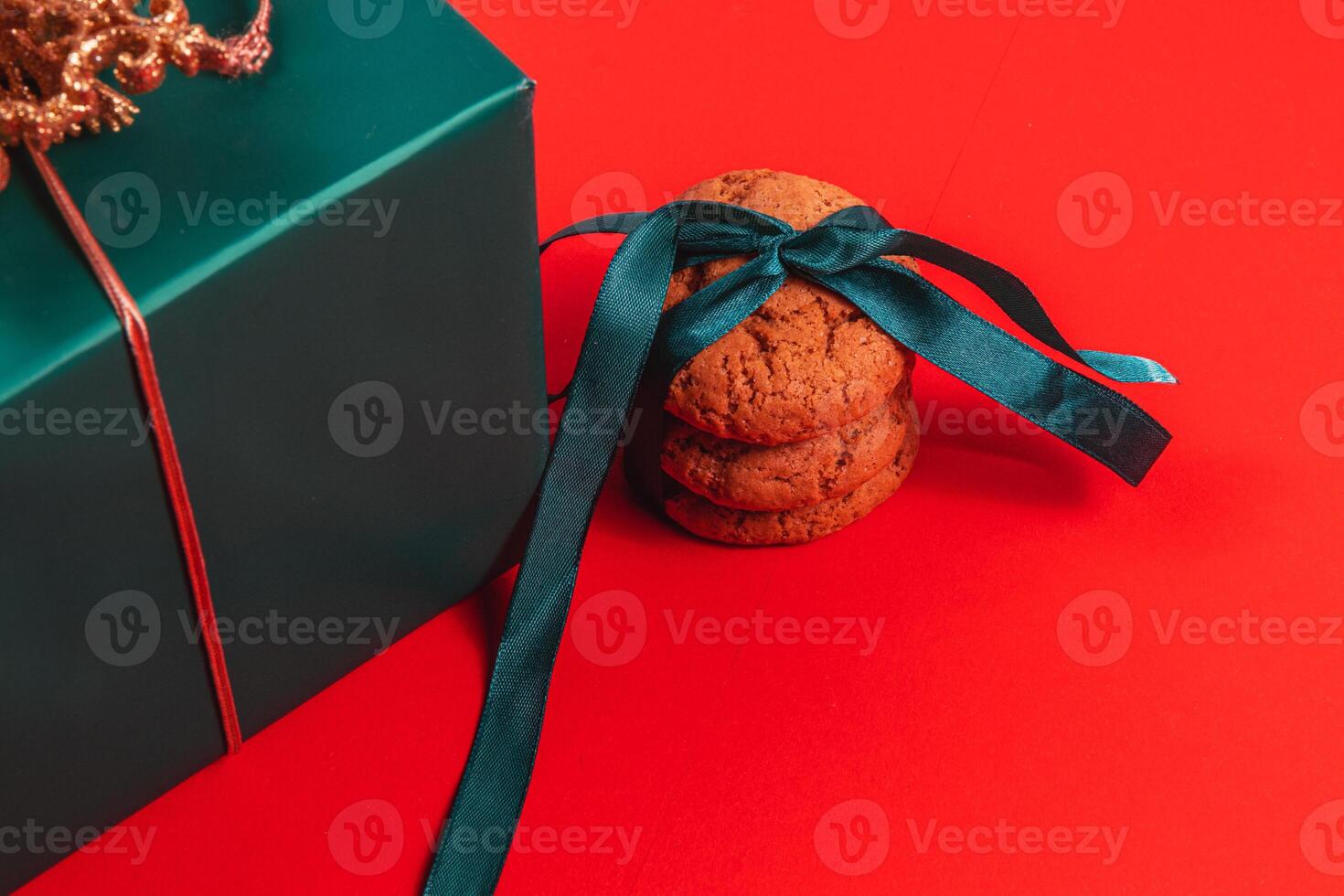 Green gift box with cookies with ribbon photo