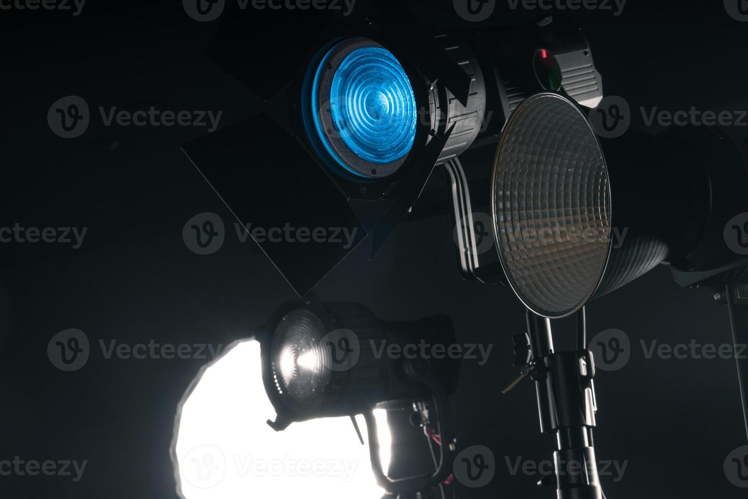 Studio Lighting Setup for a Creative Photo Shoot With Various Light Sources in a Dark Environment