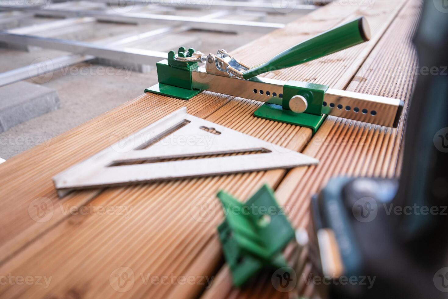 Tools Arranged on Wooden Planks for Precise Measurement and Alignment in Carpentry Workshop photo