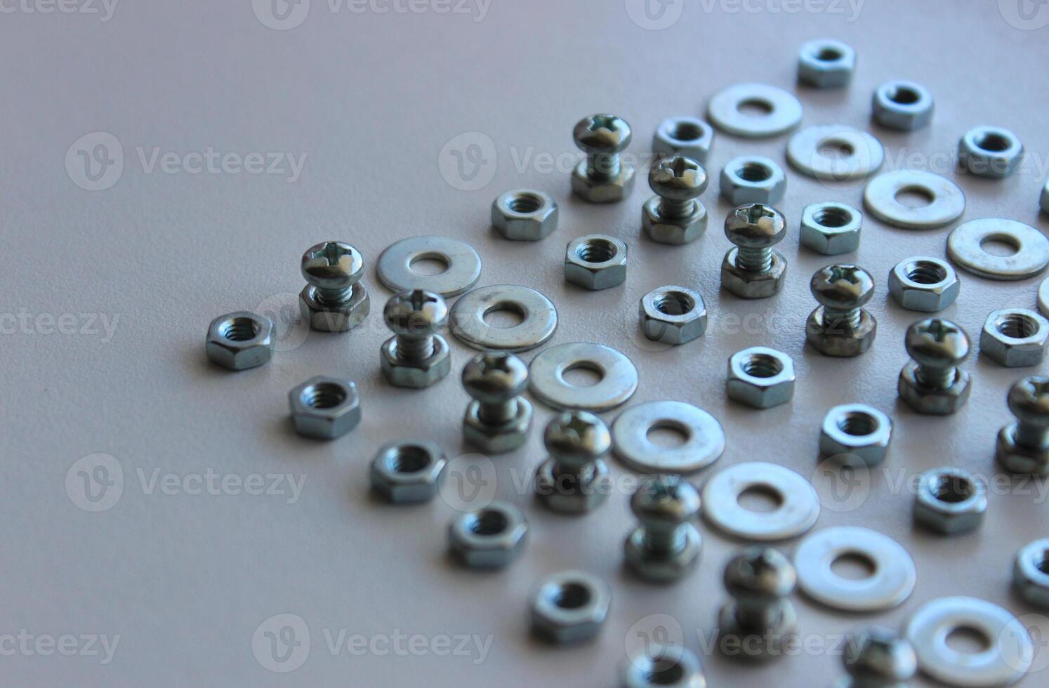 Lined Up Hardware Fixing Items On White Table Closeup Stock Photo
