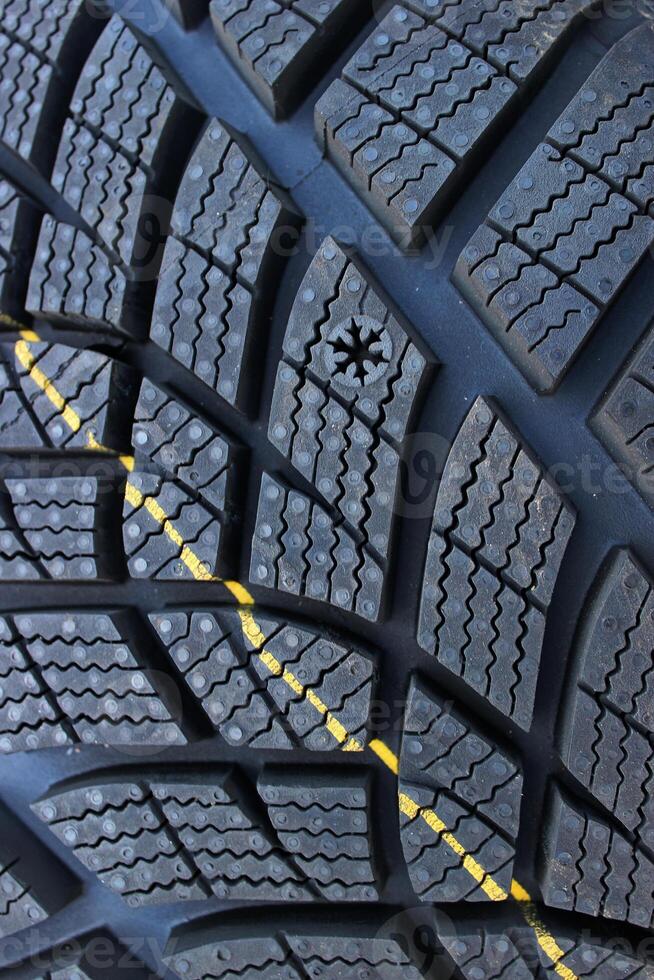Snowflake Shaped Tyre Wear Indicator On New Winter Tyre. Tire Condition Explaining. Tire Information For Driver Safety photo