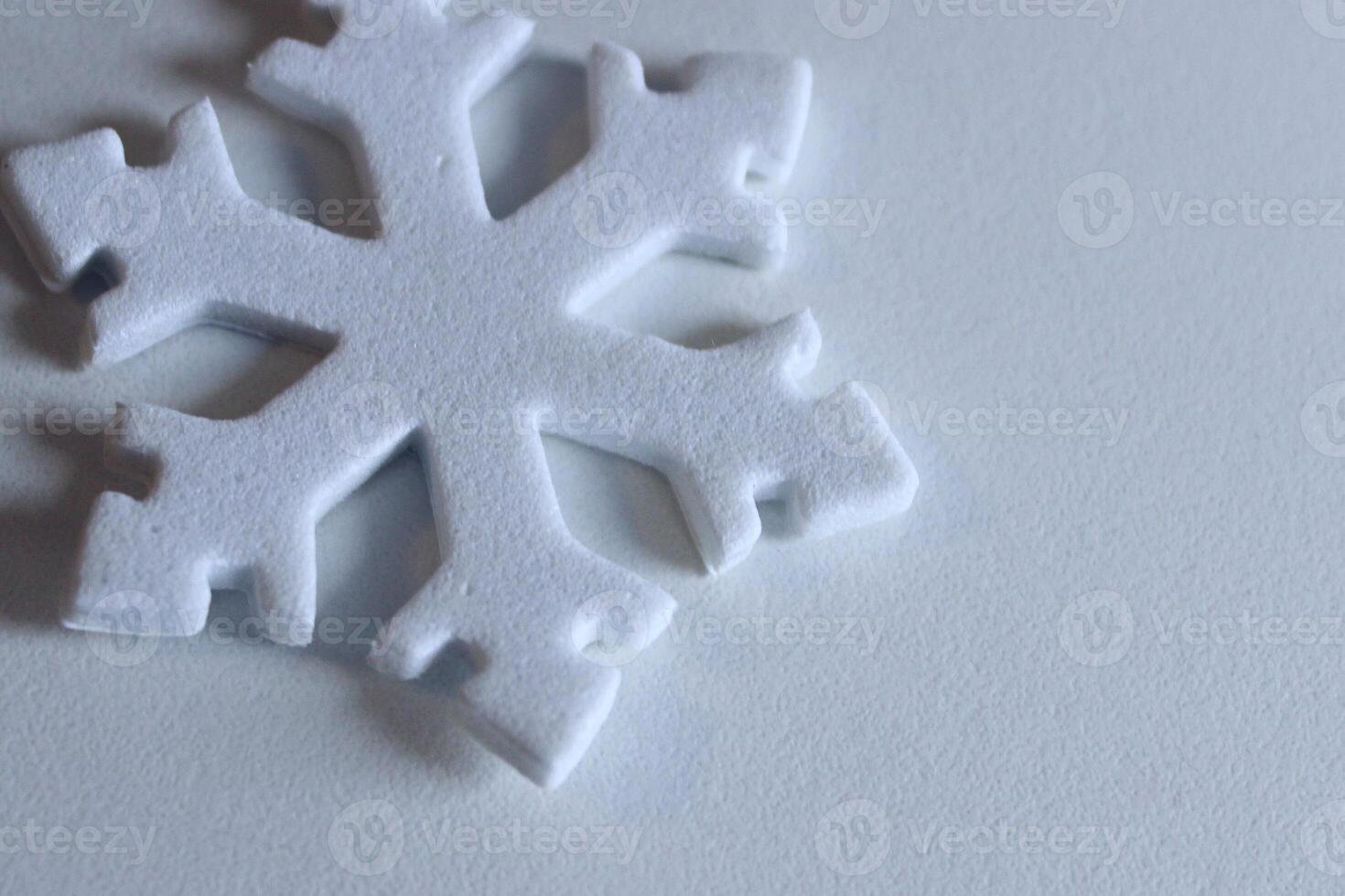 Winter Symbol For Wallpaper Or Background. Flat Snowflake With Light Shades On White Background Closeup Image photo