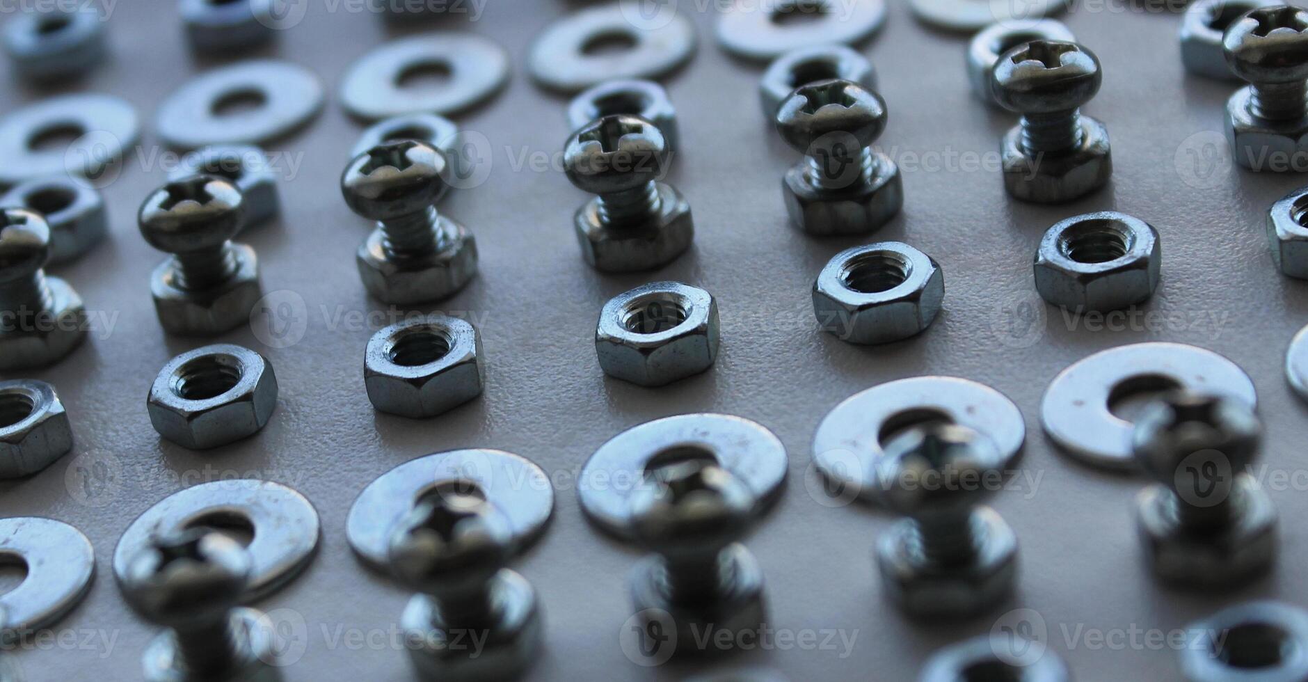 Extreme Closeup Photo Of Rows Made With Shiny Bolts, Washers And Nuts