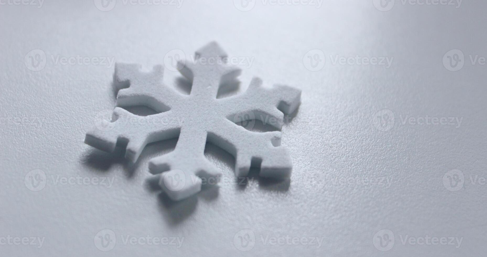 Winter Is Coming. Snowflake Isolated On Cold White Surface Angle View. Decorative Snowflake On White Copy Space Stock Photo