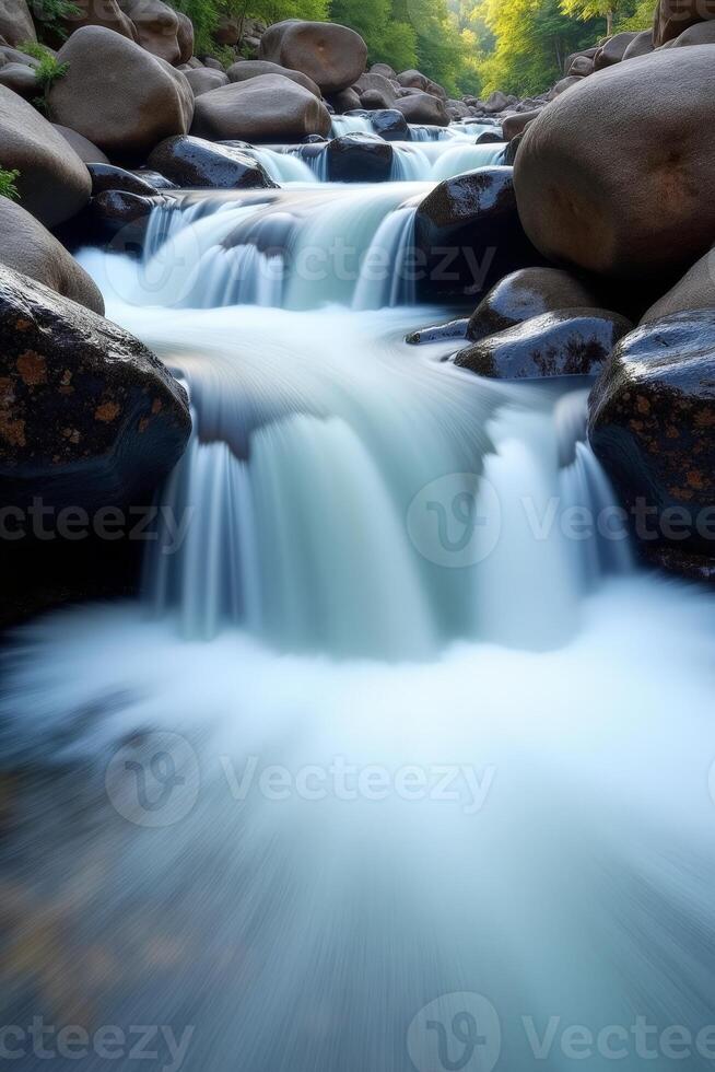A river flowing through a forest with rocks photo