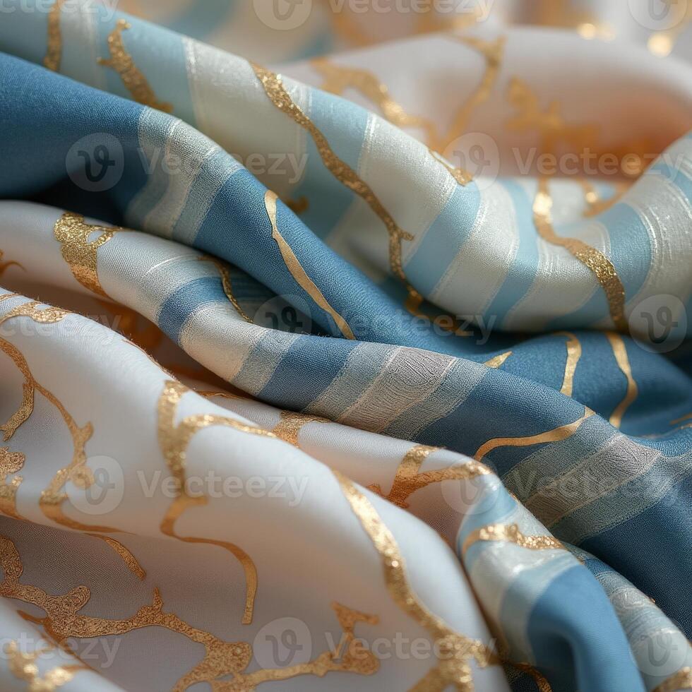 A close up of a blue and gold scarf photo