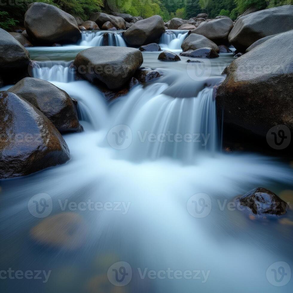 A river flowing over rocks in a forest photo