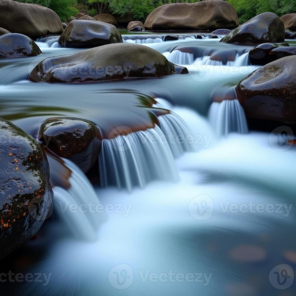 A river flowing over rocks in a forest photo