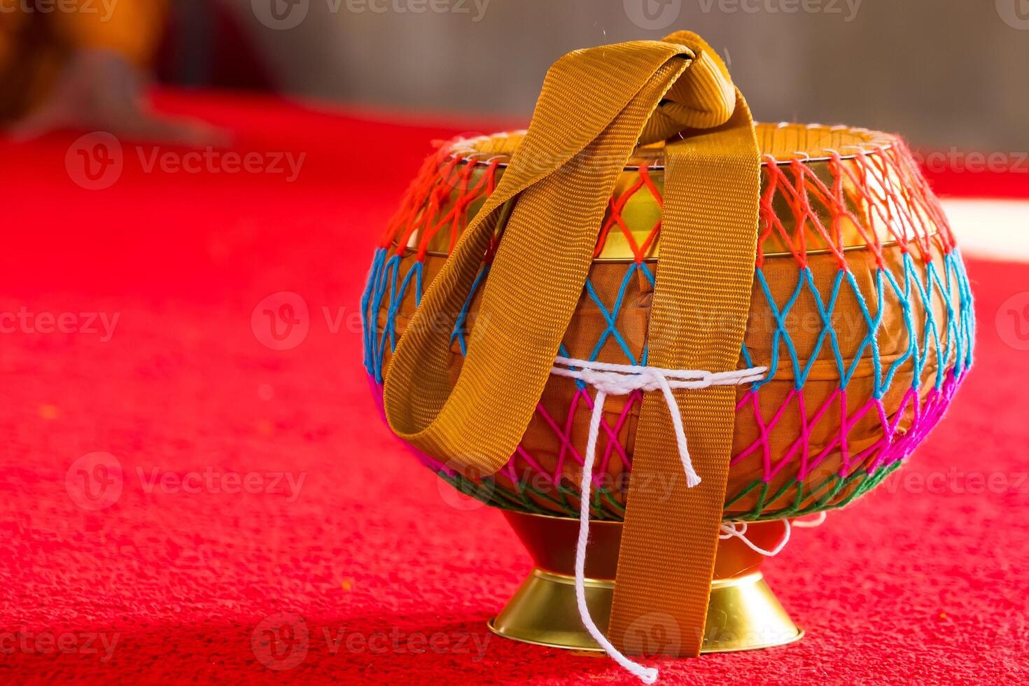 Monk's Alms Bowl Resting on the Floor of a Tranquil Buddhist Temple, Symbolizing Simplicity and Spirituality in a Sacred Space photo