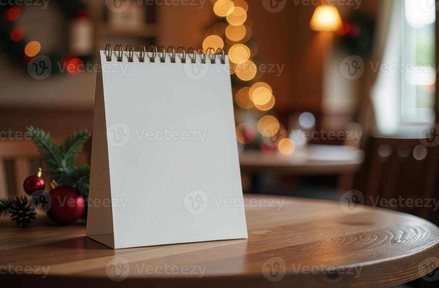 Blank menu or card on wooden table with christmas decor and glowing lights. Restaurant or cafe photo