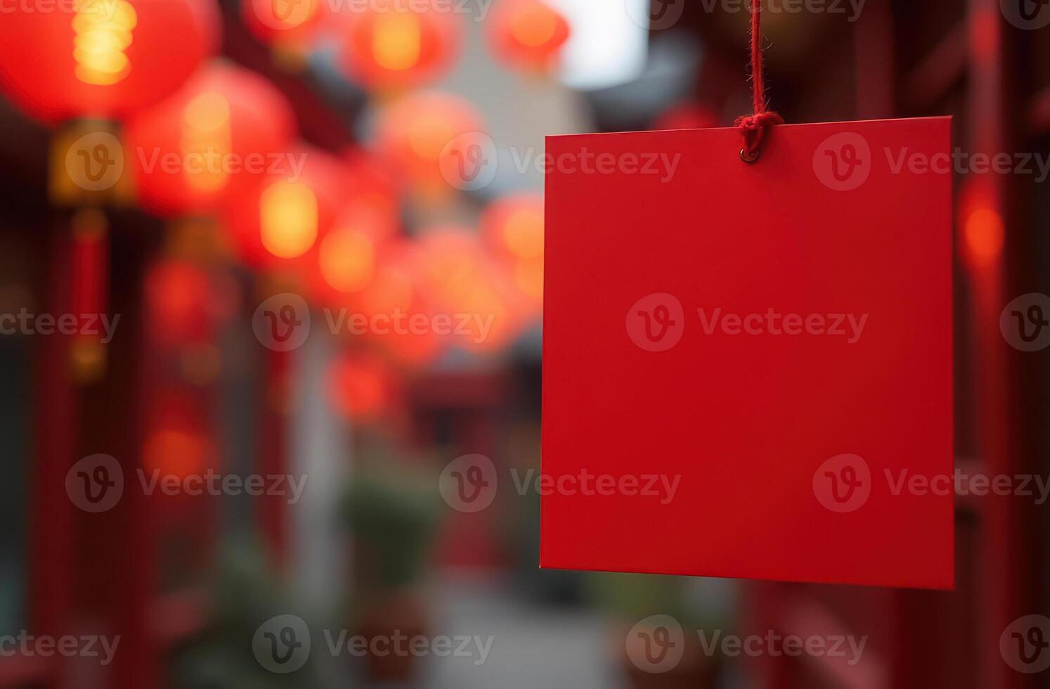 Red lanterns and blank sign in festive street. Chinese New Year photo