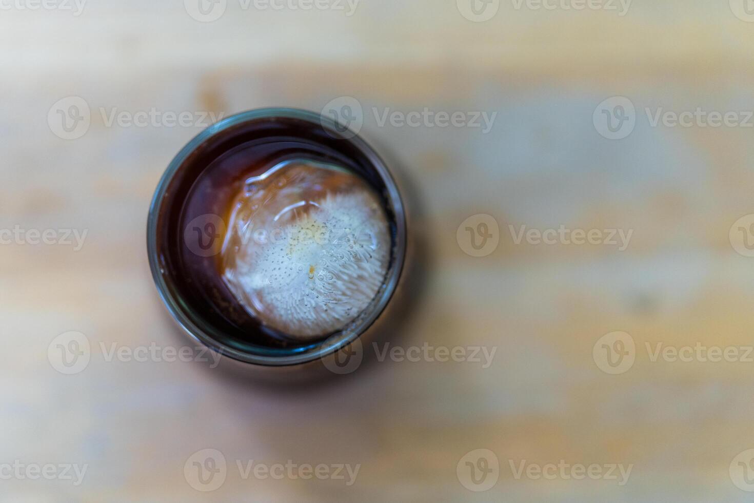 Black coffee with ice in glass photo