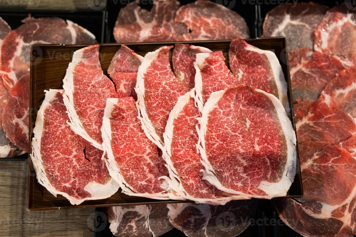 Sliced beef with fatty. Quality beef on tray for hotpot. photo